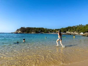 Family enjoying family-friendly activities in Orange County at the beach during sunset