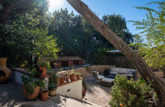 Lush, landscaped outdoor space with multiple seating areas that feel private and serene. Perfect for relaxing evenings, morning coffee, or enjoying fresh air as part of everyday living.