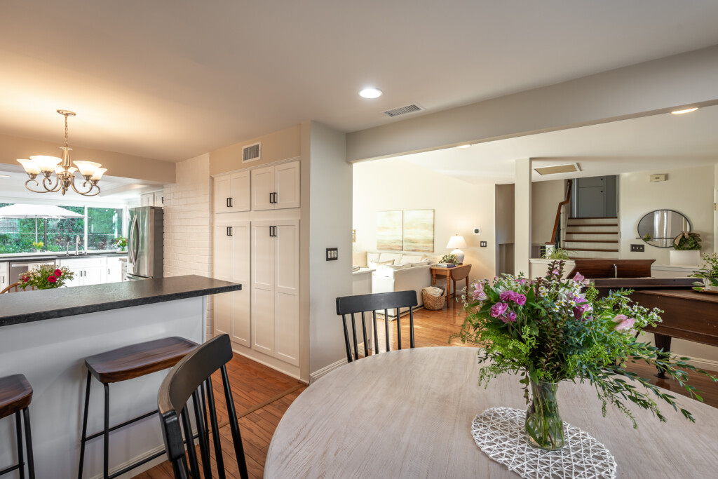 Open dining and kitchen layout with bar seating and easy flow into the main living areas. Ideal for everyday routines, casual meals, and staying connected while living and working from home.