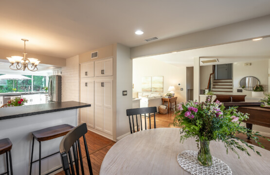 Open dining and kitchen layout with bar seating and easy flow into the main living areas. Ideal for everyday routines, casual meals, and staying connected while living and working from home.
