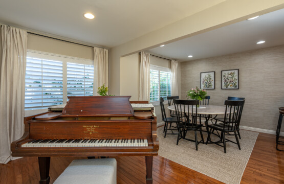 Bright dining area with space to gather, work, or share meals, plus a charming piano that adds character to the home. A welcoming setting that makes longer stays feel comfortable and lived in.