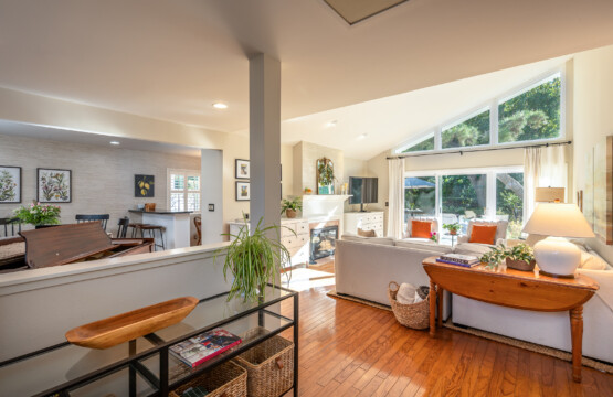 Spacious open-concept living area with soaring ceilings and abundant natural light. Seamless flow between living, dining, and kitchen spaces. Perfect for everyday comfort and easy entertaining.