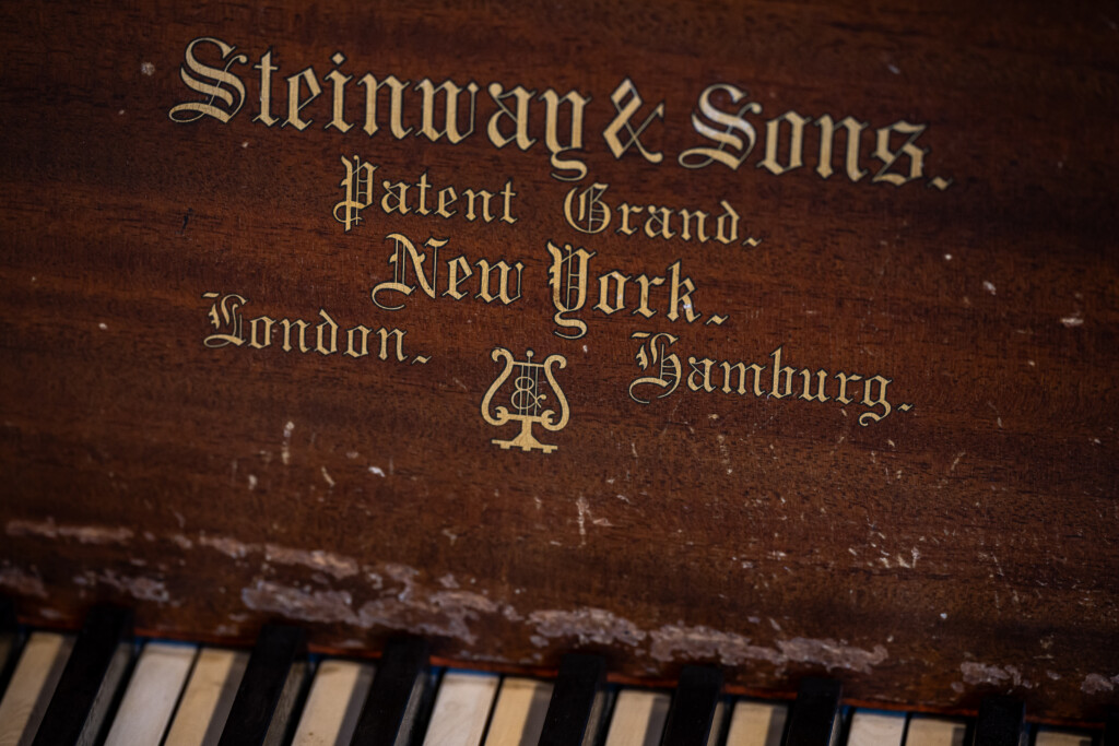 Steinway & Sons branding detail showcasing the piano’s heritage and craftsmanship.
