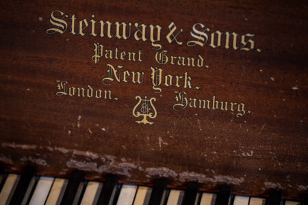 Steinway & Sons branding detail showcasing the piano’s heritage and craftsmanship.