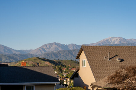 Scenic mountain and neighborhood views that bring a peaceful, open-sky feel to the home — beautiful natural backdrop visible from the outdoor spaces.