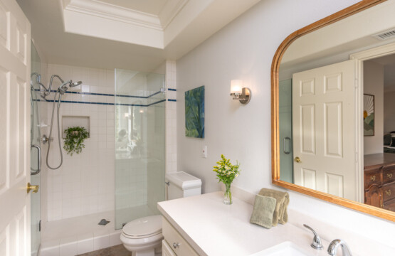 Bright, spa-inspired bathroom with a glass walk-in shower and generous vanity space for daily routines. A comfortable, easy-to-use space designed for relaxed, longer stays.