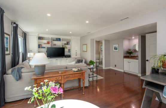 Spacious secondary living area with built-in shelving and TV, perfect for movie nights, quiet reading, or extended-stay downtime. An ideal bonus space for remote workers or families staying longer in Diamond Bar.