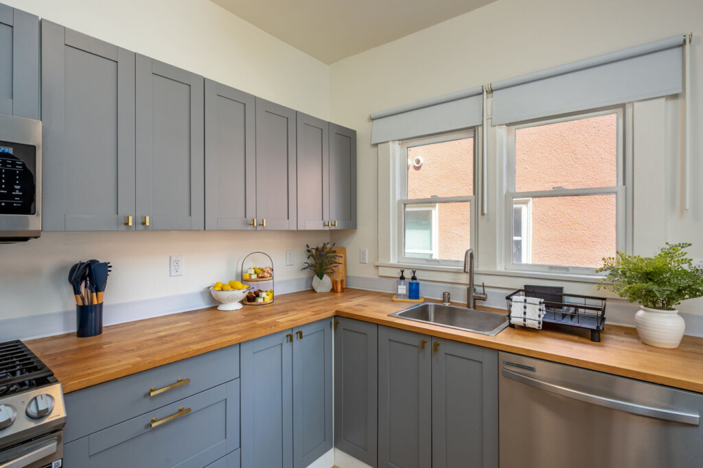 A clean, fully equipped kitchen with generous counter space and plenty of natural light. Perfect for settling into a routine, whether you’re cooking at home or starting your day with coffee by the window.