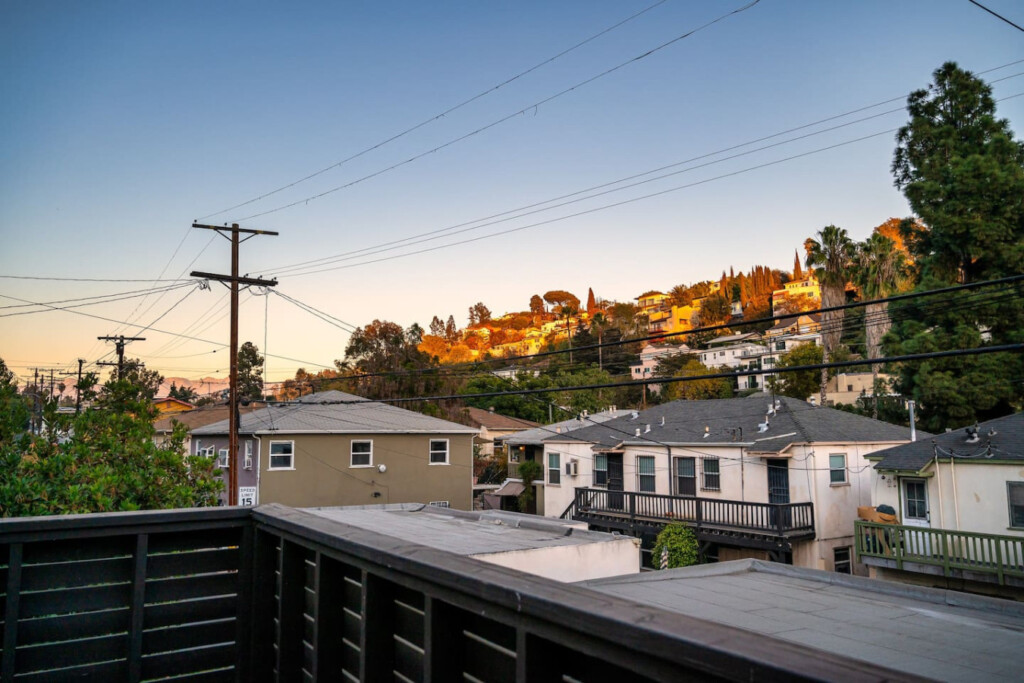 Hillside views of Silver Lake glow at sunset, bringing a sense of calm at the end of the day. A quiet reminder of the neighborhood you get to call home during your stay.