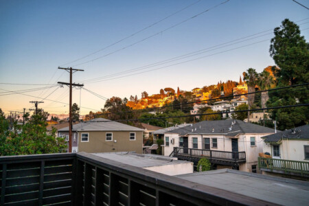 Hillside views of Silver Lake glow at sunset, bringing a sense of calm at the end of the day. A quiet reminder of the neighborhood you get to call home during your stay.