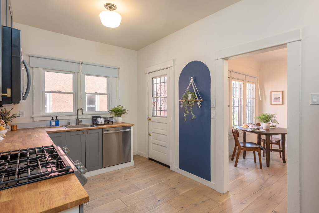 A bright kitchen that connects seamlessly to the dining area, making everyday living feel easy and intuitive. Thoughtful details and natural light create a space that’s both functional and welcoming for longer stays.