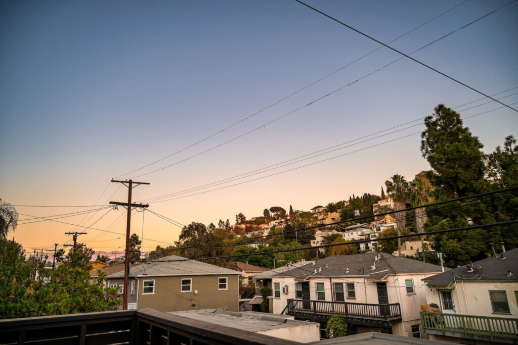 Hillside views of Silver Lake glow at sunset, bringing a sense of calm at the end of the day. A quiet reminder of the neighborhood you get to call home during your stay.