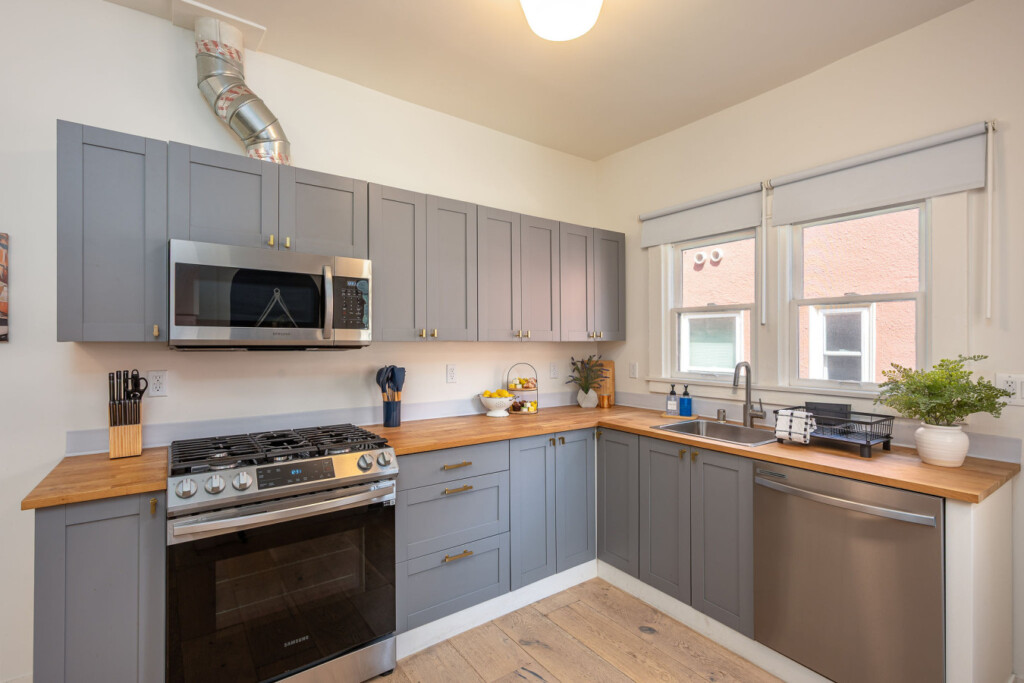 A clean, fully equipped kitchen with generous counter space and plenty of natural light. Perfect for settling into a routine, whether you’re cooking at home or starting your day with coffee by the window.