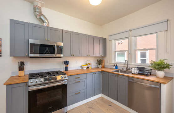 A clean, fully equipped kitchen with generous counter space and plenty of natural light. Perfect for settling into a routine, whether you’re cooking at home or starting your day with coffee by the window.