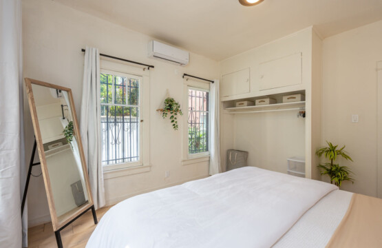 A quiet vanity corner with warm wood accents and soft lighting, perfect for getting ready or easing into your day. Thoughtfully placed to feel both private and connected within the home.