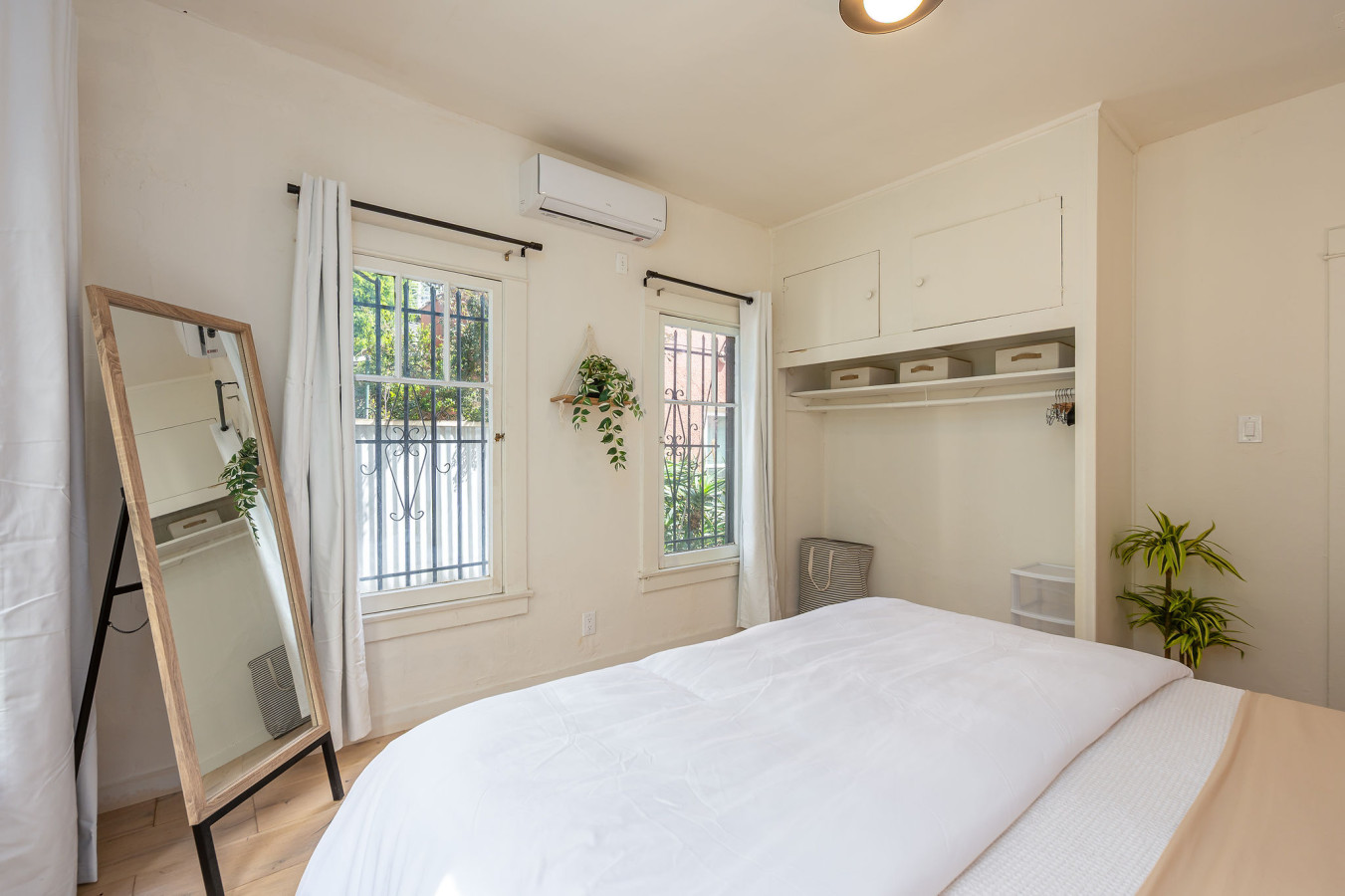A quiet vanity corner with warm wood accents and soft lighting, perfect for getting ready or easing into your day. Thoughtfully placed to feel both private and connected within the home.