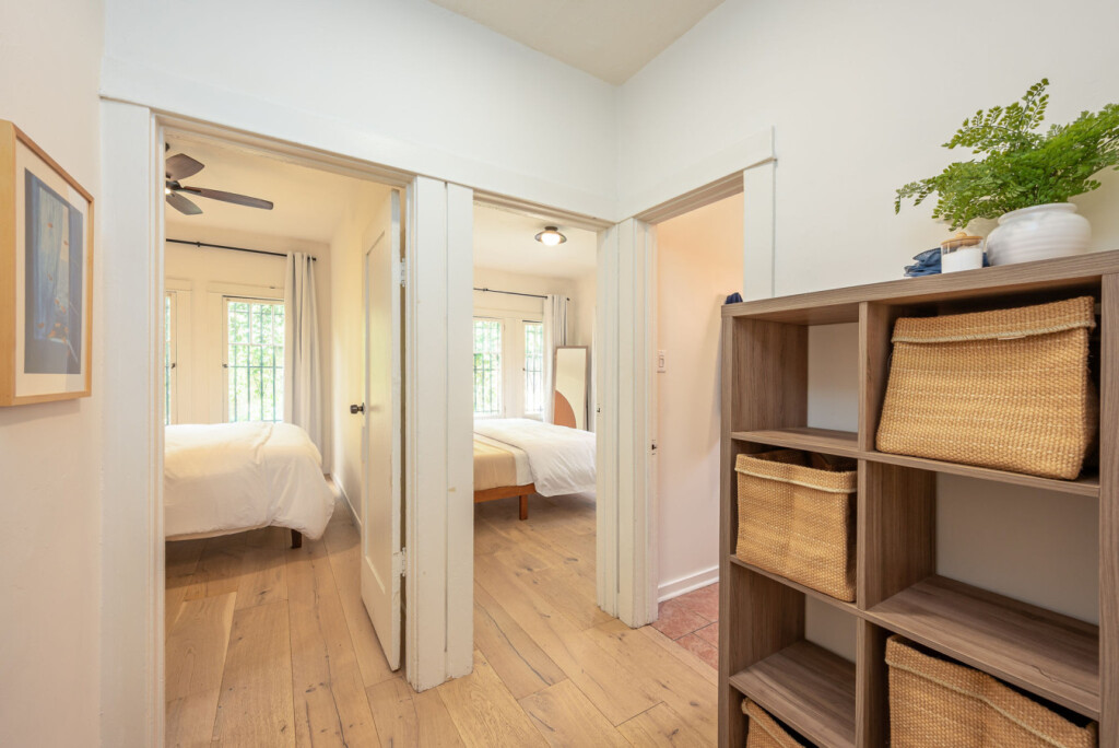 A practical hallway with built-in storage that keeps everyday living organized and easy. With bedrooms just off the corridor, the layout offers both convenience and a sense of privacy for longer stays.