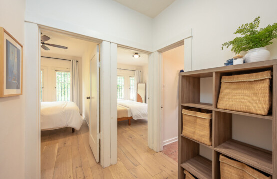 A practical hallway with built-in storage that keeps everyday living organized and easy. With bedrooms just off the corridor, the layout offers both convenience and a sense of privacy for longer stays.